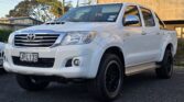2015 white Toyota Hilux SR5 4WD double cab, front three-quarter view